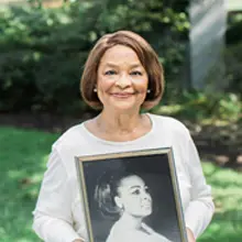 Woman Holding a Portrait